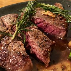 A picture of Medium rare rump steak with rosemary 🌱 🥩.