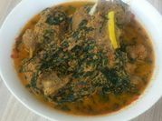 A picture of egusi soup and tomato