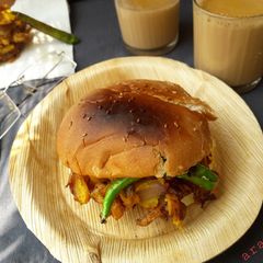 A picture of Baked cheesei vada pav.