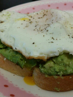 A picture of Avocado toast with fried egg.