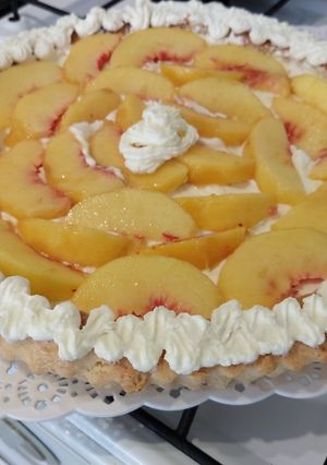 Una foto de Tarta de durazno con crema