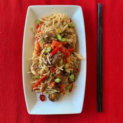 A picture of Salt and Pepper Chicken with noodles.