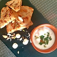 A picture of Falahari halwa paratha with makhane ka raita.