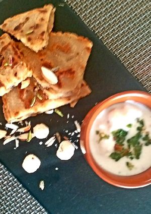 A picture of Falahari halwa paratha with makhane ka raita.