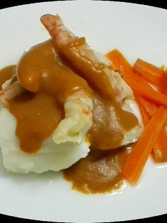 Una foto de Merluza en crema de gambas