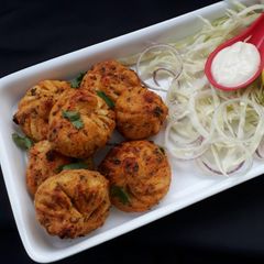 A picture of Veg Tandoori Momos.