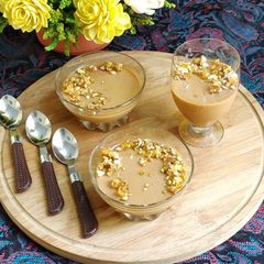 A picture of Salted Caramel Panna Cotta Topped with Praline.