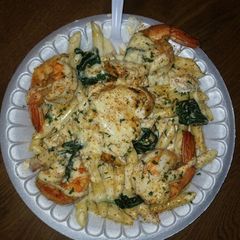A picture of Chicken & shrimp Alfredo.