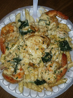 A picture of Chicken & shrimp Alfredo.