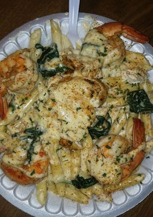 A picture of Chicken & shrimp Alfredo.