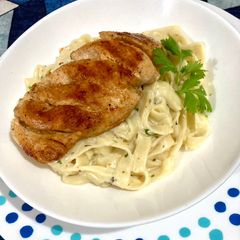 Grilled chicken in apricot oil with Alfredo Fettuccine A picture of Grilled chicken in apricot oil with Alfredo Fettuccine.