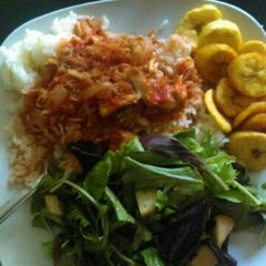 A picture of Boiled rice, Fried eggs, Fried plantains with apple salad dressing.