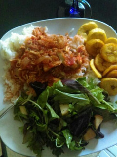 A picture of Boiled rice, Fried eggs, Fried plantains with apple salad dressing.