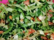 A picture of tomato spring onions carrot