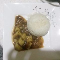 A picture of Rice and dengu stew(greengrams).