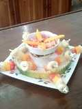 Cóctel de frutas en miel con banderillas de fruta