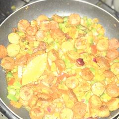 A picture of Stir fry veggies and sausage.