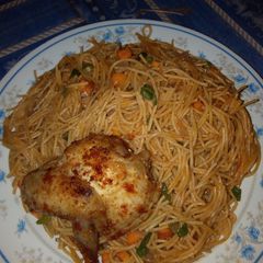 Spaghetti bolognese and marinated chicken A picture of Spaghetti bolognese and marinated chicken.