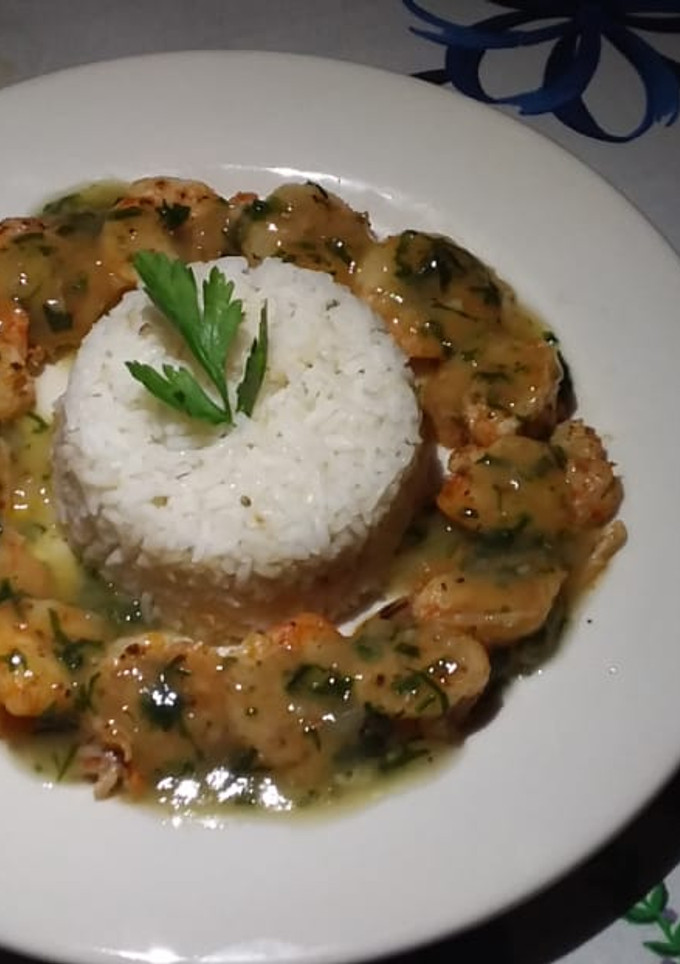 Una foto de Camarones flameados