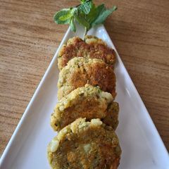 A picture of Rice flakes and potato cutlet.