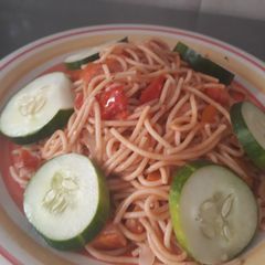 A picture of Spagetti with cucumber.