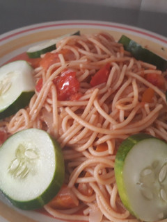 A picture of Spagetti with cucumber.