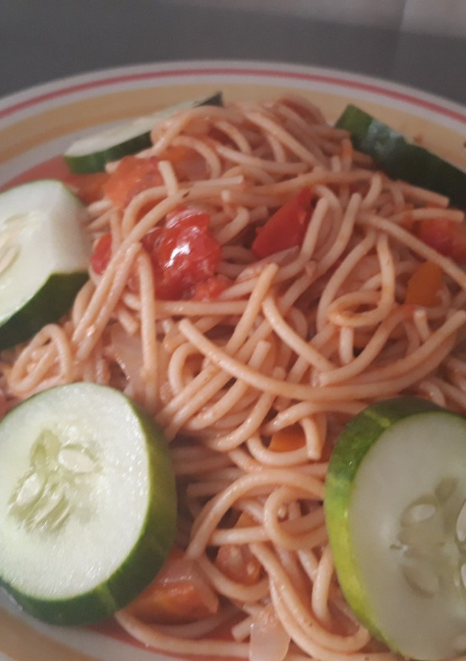 A picture of Spagetti with cucumber.