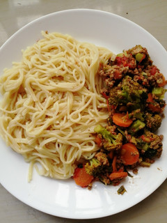 A picture of Broccoli stir fry and spaghetti.