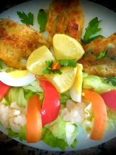 A picture of Sardine fritters with green salad.