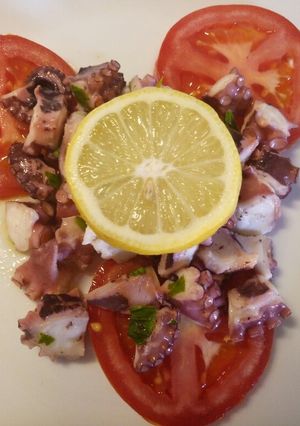 A picture of Octopus and tomato salad.