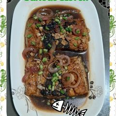 A picture of Bangus Bistek (Milkfish steak).