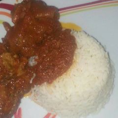 A picture of Cowleg & chicken stew with white rice.