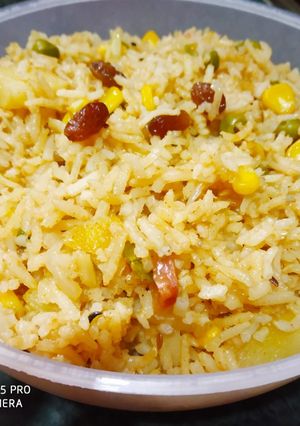 A picture of Brown Rice with lots of veggis.