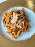 Malloreddus alla Campidanese (pasta with saffron, tomato and pork sausage ragù)
