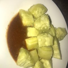 A picture of Boiled sweet potatoes with kuli kuli.