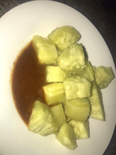 A picture of Boiled sweet potatoes with kuli kuli.