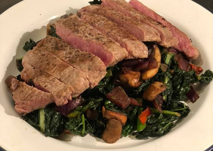 Steak with cavolo nero and chestnut mushrooms