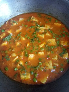 A picture of Paneer in Malai and tomato gravy.