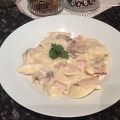 A picture of Creamy mushroom and bacon ravioli.