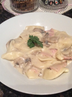 A picture of Creamy mushroom and bacon ravioli.