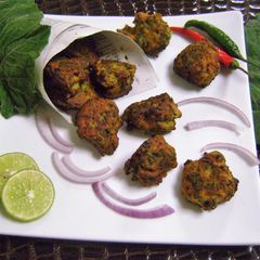 A picture of Kumro Pata Bora (Pumpkin Leaves Pakoras - Bengali Style).