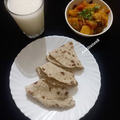 Sorghum flatbreads with Potato onion Sabzi A picture of Sorghum flatbreads with Potato onion Sabzi.