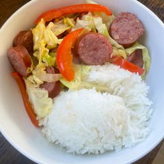 A picture of Kielbasa with Bell peppers and Cabbage 🥬🫑.