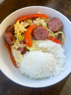 A picture of Kielbasa with Bell peppers and Cabbage 🥬🫑.