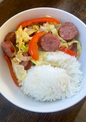 A picture of Kielbasa with Bell peppers and Cabbage 🥬🫑.