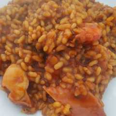 Una foto de Arroz meloso de pulpo y langostinos