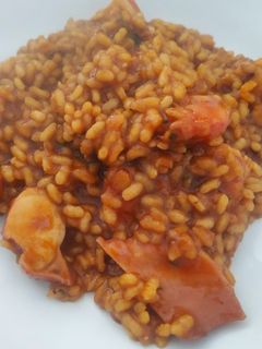 Una foto de Arroz meloso de pulpo y langostinos