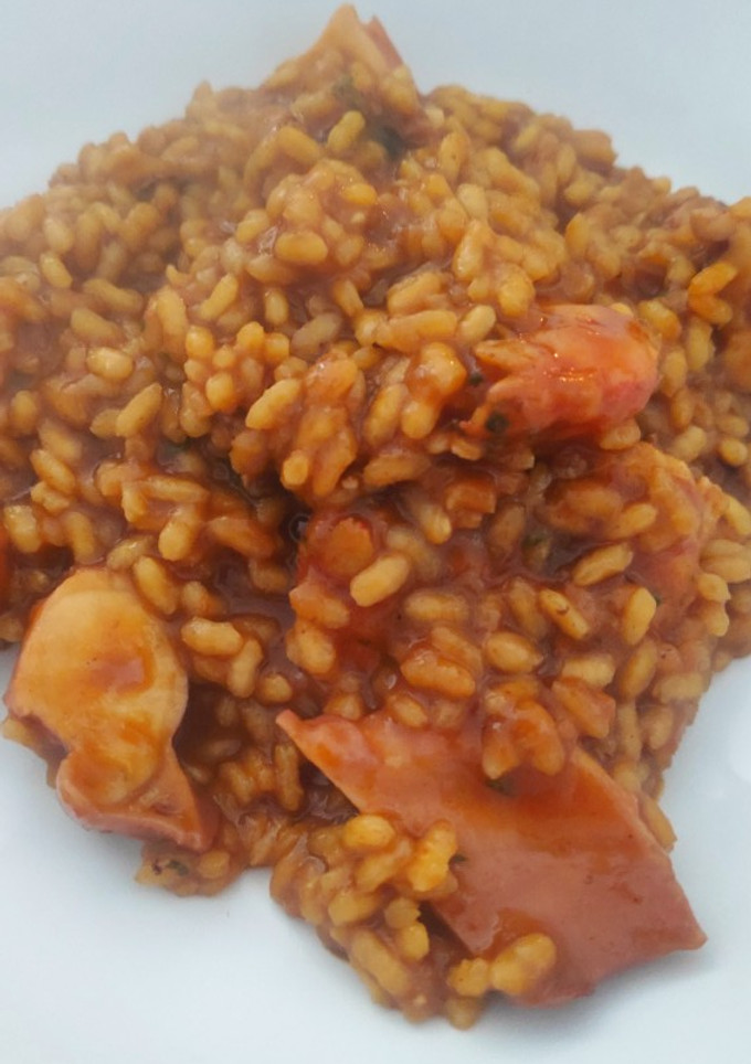 Una foto de Arroz meloso de pulpo y langostinos