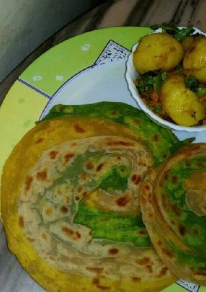 A picture of TRIANGA LUCHHA PARATHA and aloo curri.