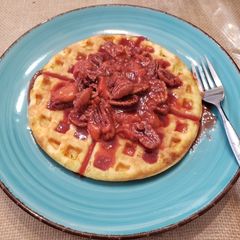 A picture of Keto Waffles with Strawberry Pecan Topping.
